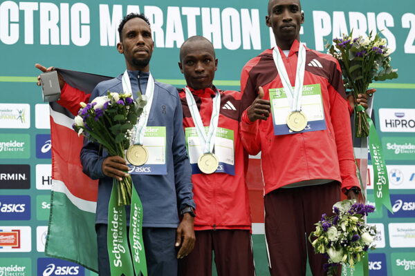 Athletics - Paris Marathon - Paris, France - April 13, 2025
Kenya's Benard Biwott celebrates on the podium after winning the men's Paris Marathon with second placed Djibouti's Ibrahim Hassan and third placed Kenya's Sila Kiptoo REUTERS/Stephanie Lecocq